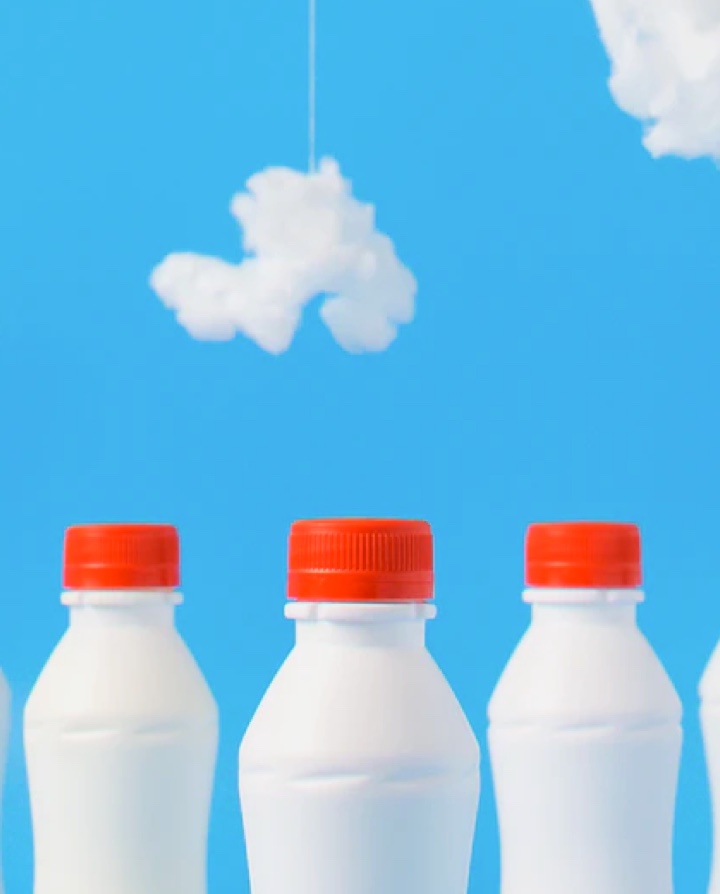 milk bottles lined up next to each other